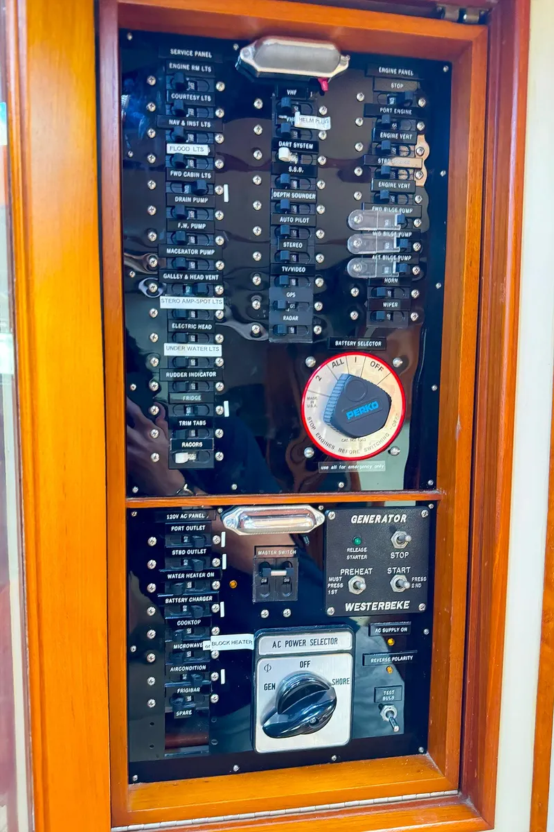 Slide: The Image of Electrical panel of 1995 Grand Banks 38 Eastbay EX boat with switches and gauges. - 28