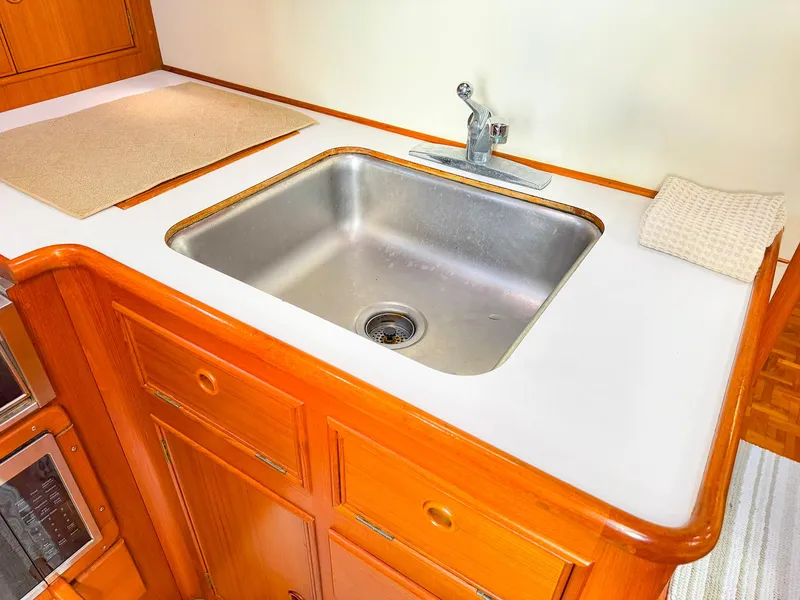 Slide: The Image of Stainless steel sink in 1995 Grand Banks 38 Eastbay EX yacht kitchen. - 30