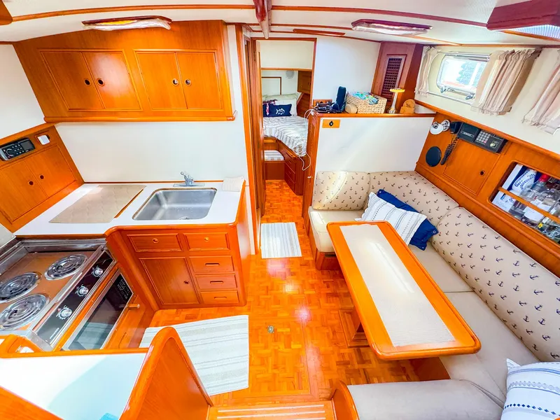 Slide: The Image of Interior of 1995 Grand Banks 38 Eastbay EX yacht with kitchen and seating area. - 35