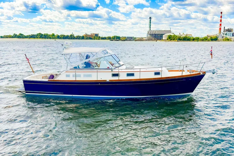 Slide: The Image of 1995 Grand Banks 38 Eastbay EX cruising on a sunny day. - 37
