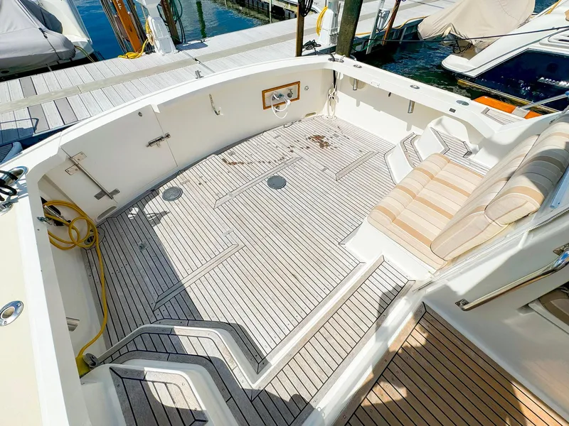 Slide: The Image of Spacious deck of 1995 Grand Banks 38 Eastbay EX yacht at marina. - 4