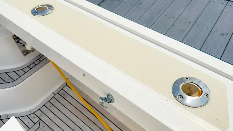 Slide: The Image of Deck detail of 1995 Grand Banks 38 Eastbay EX with rod holders and yellow cable. - 6