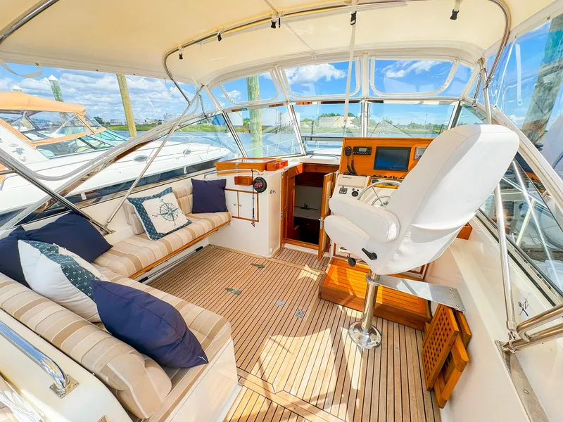 Slide: The Image of Interior of 1995 Grand Banks 38 Eastbay EX yacht with helm and seating area. - 7