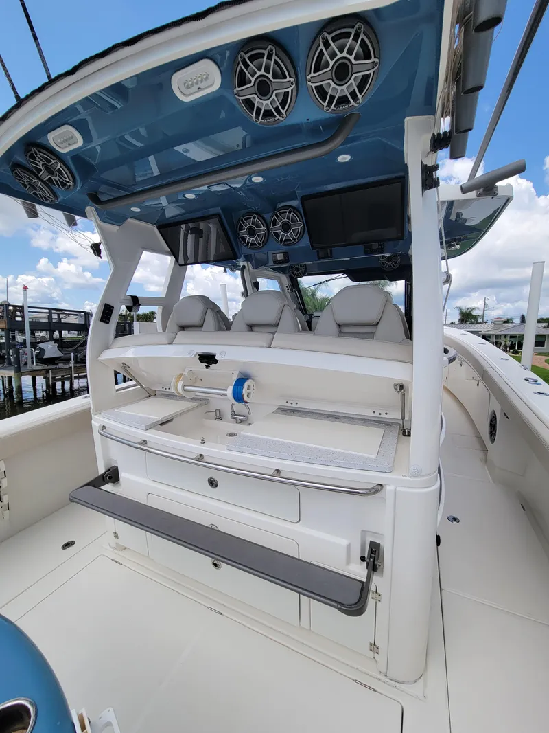 Slide: The Image of 2023 Solace 41 CS boat interior with modern seating and advanced audio system. - 19