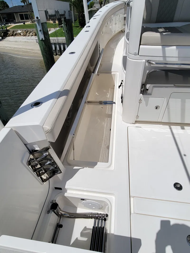 Slide: The Image of 2023 Solace 41 CS boat deck with storage compartments and seating area. - 26