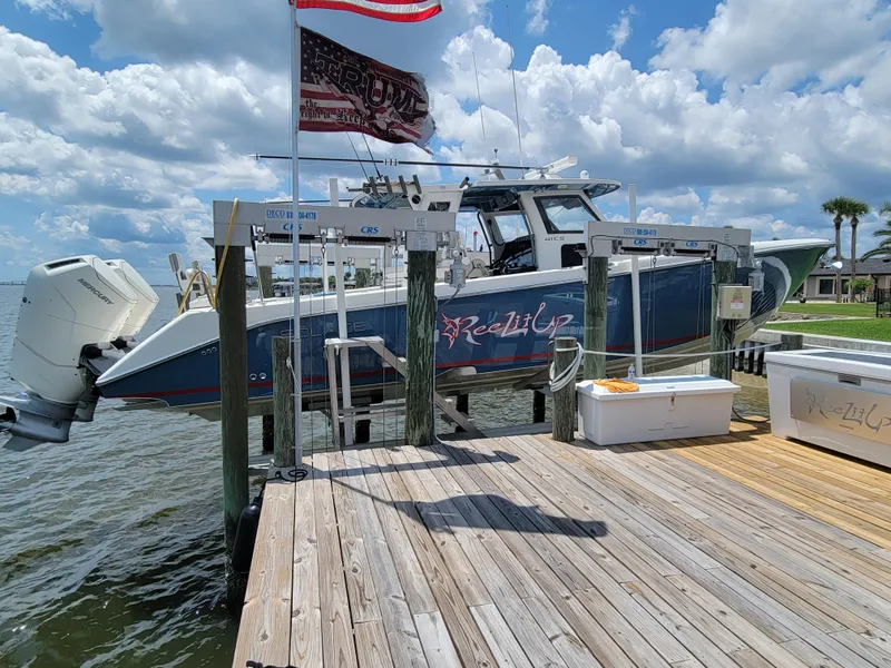 Slide: The Image of 2023 Solace 41 CS boat docked under a cloudy sky. - 3