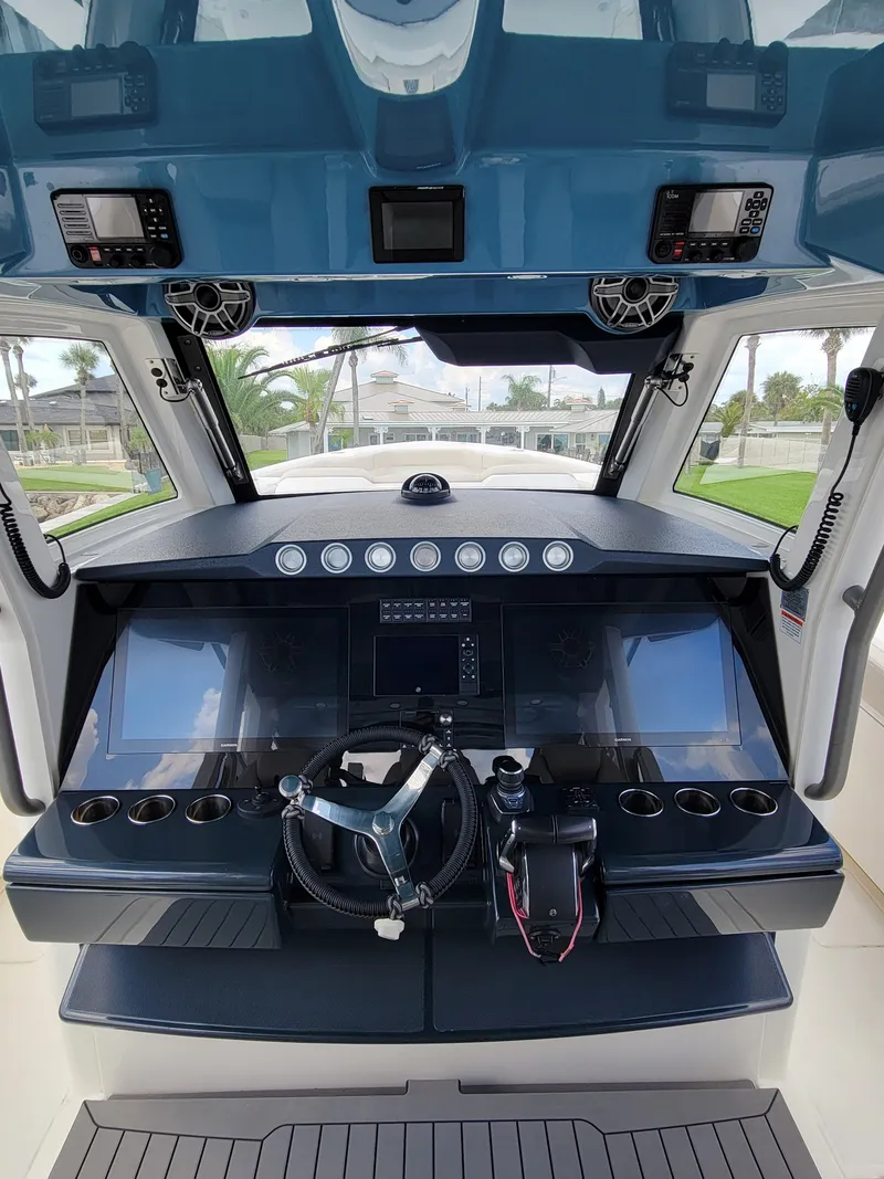 Slide: The Image of 2023 Solace 41 CS boat cockpit with advanced navigation controls and sleek design. - 33
