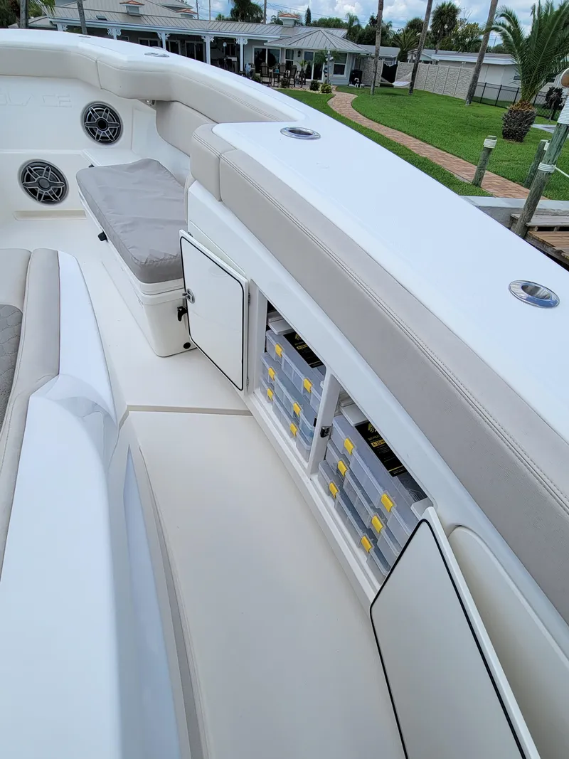 Slide: The Image of 2023 Solace 41 CS boat interior with storage compartments and seating. - 38