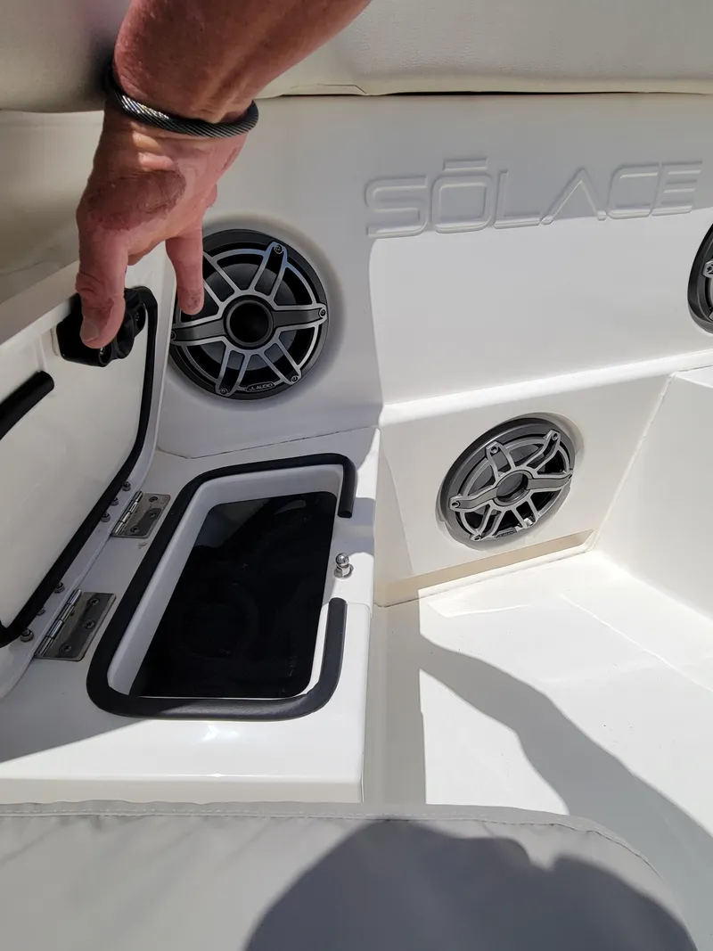 Slide: The Image of 2023 Solace 41 CS boat interior with speaker system and storage compartment. - 40
