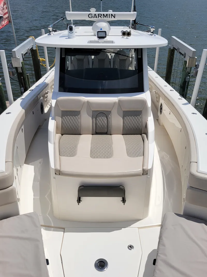 Slide: The Image of 2023 Solace 41 CS boat with Garmin equipment, featuring spacious seating and sleek design. - 45