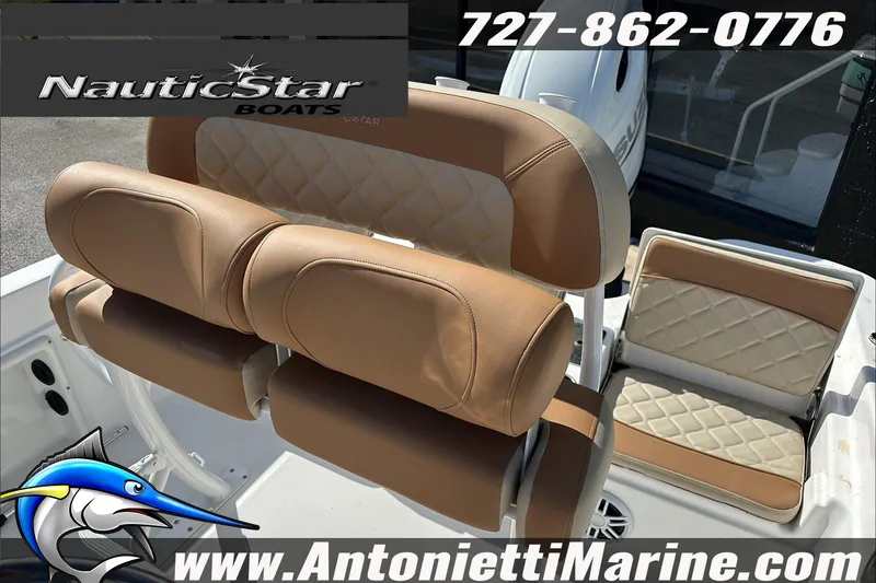 Slide: The Image of 2025 NauticStar 211 Hybrid boat seats with tan upholstery, featuring logo and contact details. - 14