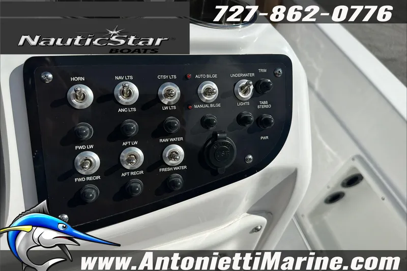 Slide: The Image of Control panel of 2025 NauticStar 211 Hybrid boat with various switches and USB port. - 18