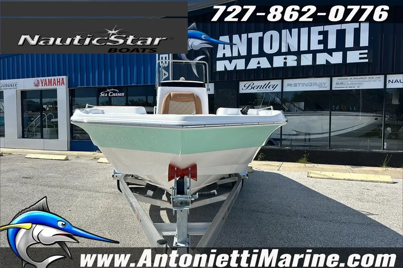 Slide: The Image of 2025 NauticStar 211 Hybrid boat displayed at Antonietti Marine dealership. - 3