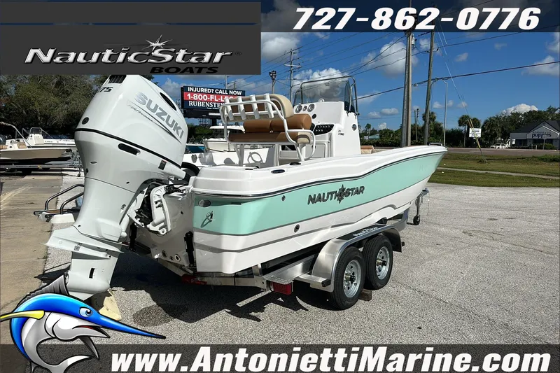 Slide: The Image of 2025 NauticStar 211 Hybrid boat with Suzuki engine on trailer at Antonietti Marine. - 8