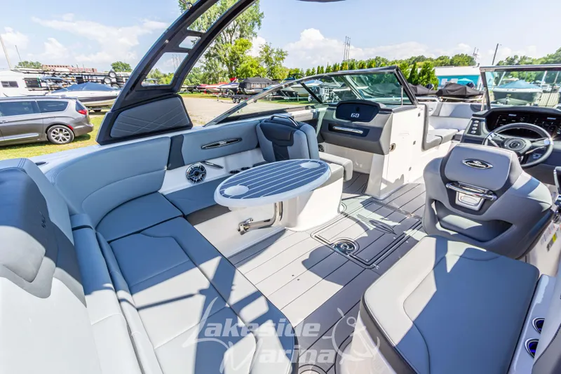 Slide: The Image of Luxurious 2025 Chaparral 247 SSX boat interior with sleek seating and modern dashboard. - 18