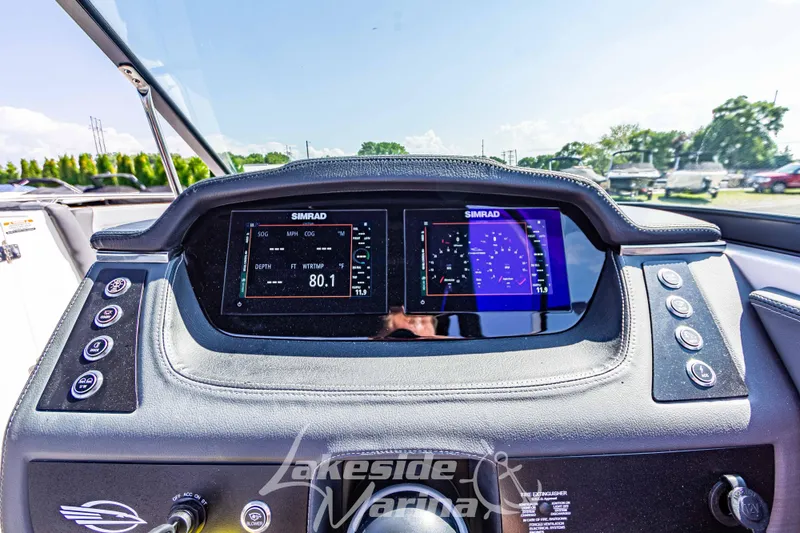 Slide: The Image of Dashboard of 2025 Chaparral 247 SSX boat with digital displays and controls. - 25