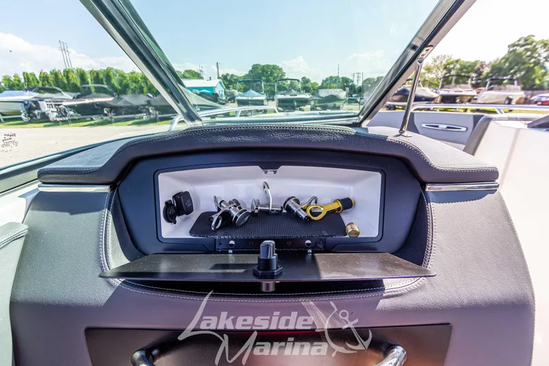 Slide: The Image of 2025 Chaparral 247 SSX dashboard view at Lakeside Marina. - 27