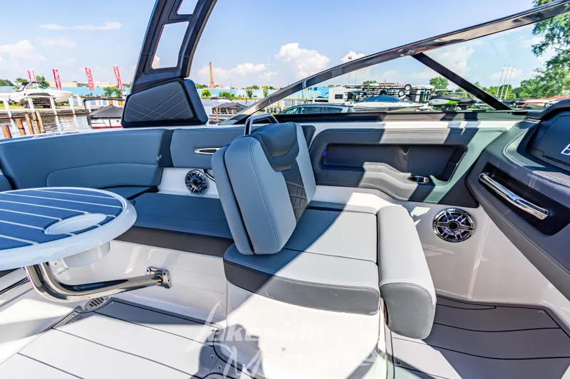 Slide: The Image of 2025 Chaparral 247 SSX boat interior with modern seating and table. - 28