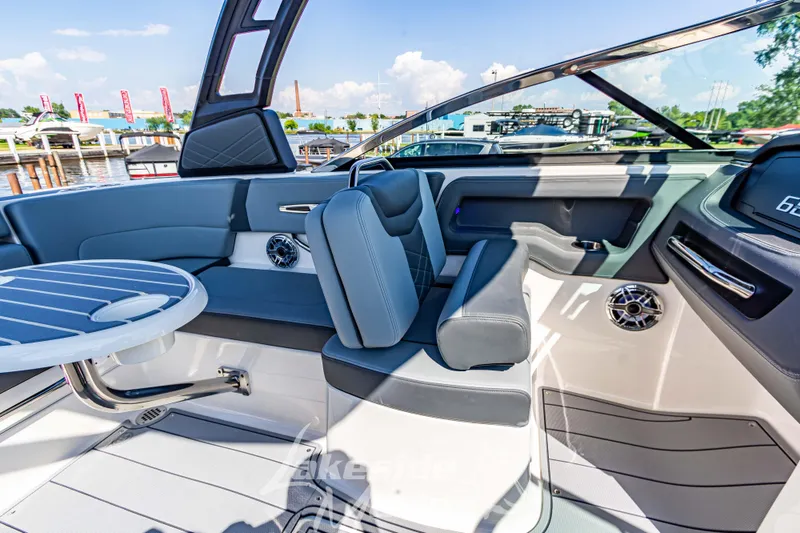 Slide: The Image of 2025 Chaparral 247 SSX boat interior with modern seating and sleek design. - 29