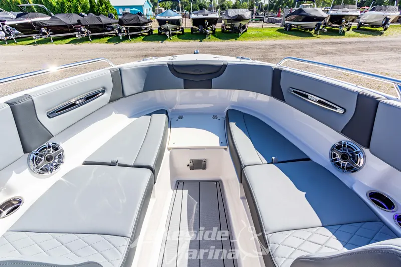 Slide: The Image of 2025 Chaparral 247 SSX boat interior with gray seating and modern design. - 35