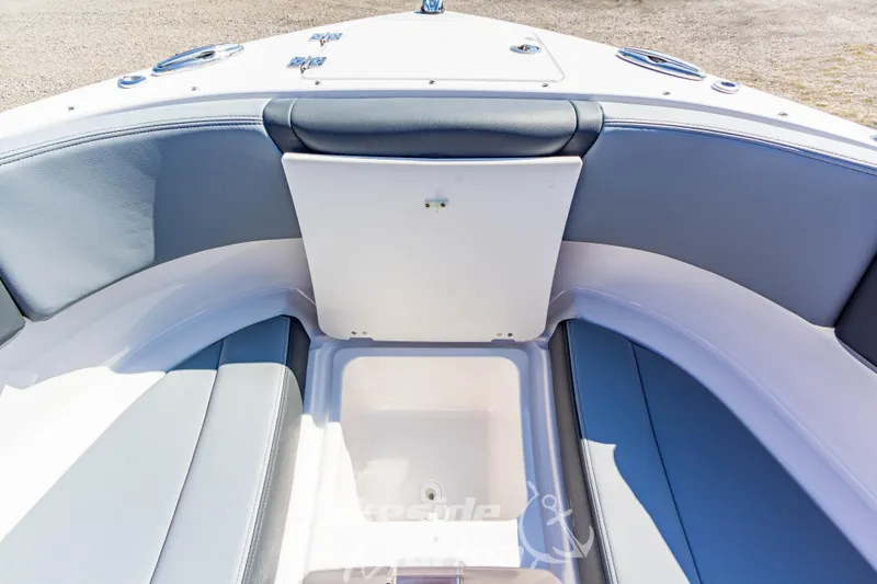 Slide: The Image of 2025 Chaparral 247 SSX boat interior with seating and storage compartment. - 36