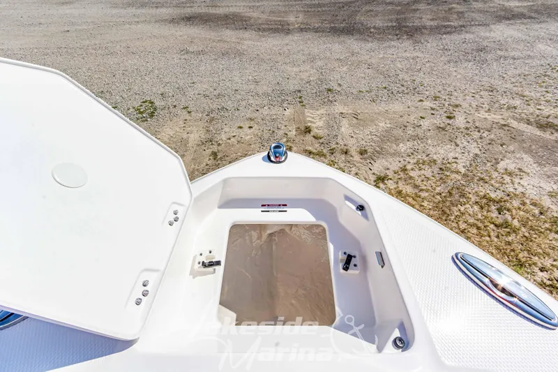 Slide: The Image of 2025 Chaparral 247 SSX boat storage compartment open on deck. - 37