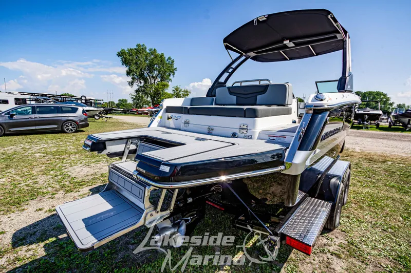 Slide: The Image of 2025 Chaparral 247 SSX boat on trailer, rear view, outdoor display. - 4