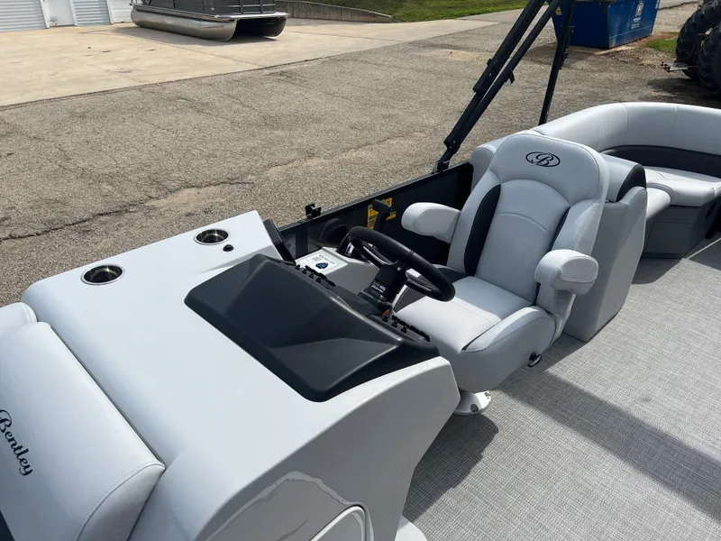 Slide: The Image of 2025 Bentley Pontoons Legacy Navigator interior with sleek white seating and modern dashboard. - 12