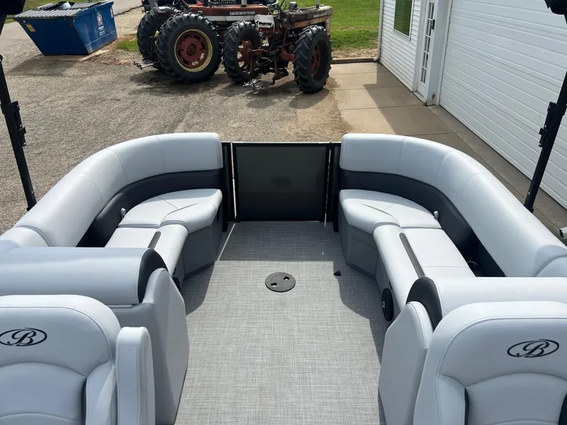 Slide: The Image of 2025 Bentley Pontoons Legacy Navigator interior with plush seating and modern design. - 15