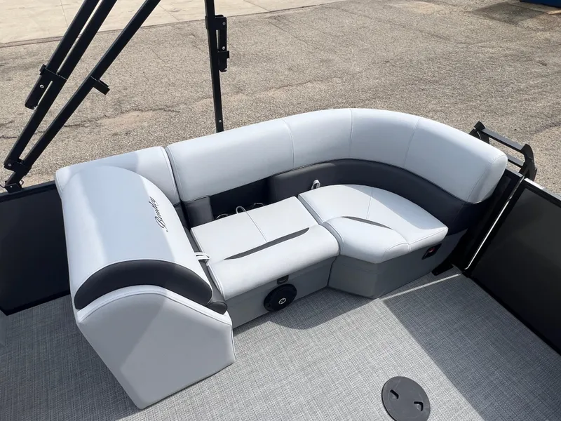 Slide: The Image of 2025 Bentley Pontoons Legacy Navigator interior seating, featuring sleek gray upholstery. - 17