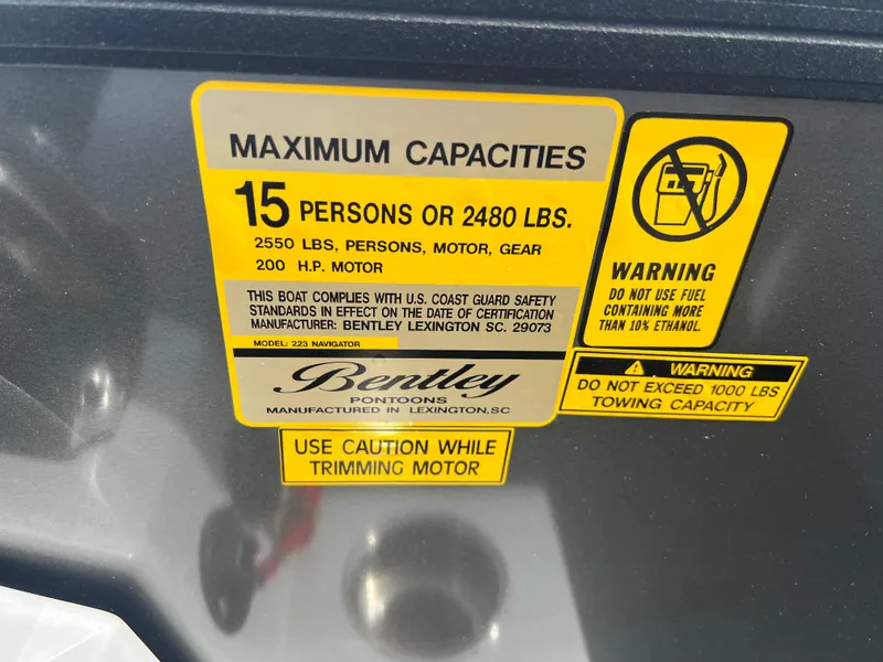 Slide: The Image of 2025 Bentley Pontoons Legacy Navigator capacity label, 15 persons or 2480 lbs, safety warnings. - 19