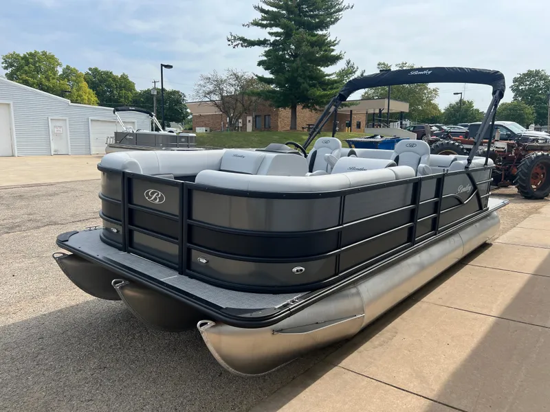 Slide: The Image of 2025 Bentley Pontoons Legacy Navigator, sleek design, parked outdoors. - 3