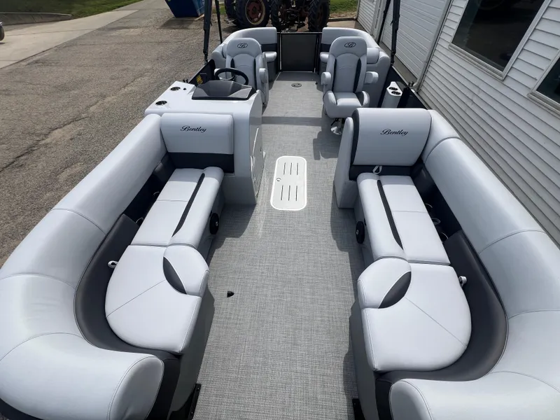 Slide: The Image of 2025 Bentley Pontoons Legacy Navigator interior with luxurious seating and modern design. - 7