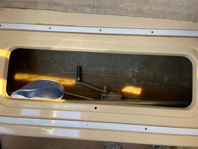 Slide: The Image of Storage compartment in a 2006 MacGregor 26M sailboat. - 24
