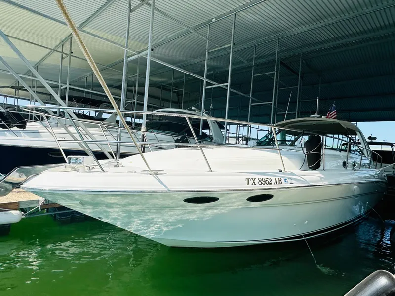 Slide: The Image of 2002 Sea Ray 410 Express Cruiser docked in marina. - 14