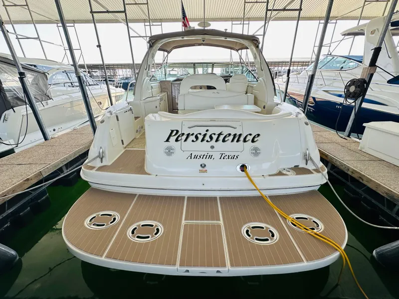 Slide: The Image of 2002 Sea Ray 410 Express Cruiser docked, named "Persistence," Austin, Texas. - 19