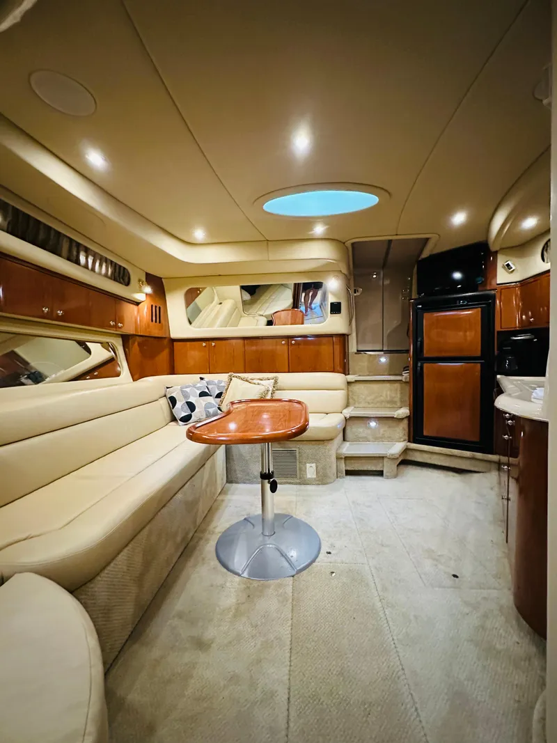Slide: The Image of Luxurious interior of 2002 Sea Ray 410 Express Cruiser with elegant seating and modern amenities. - 34
