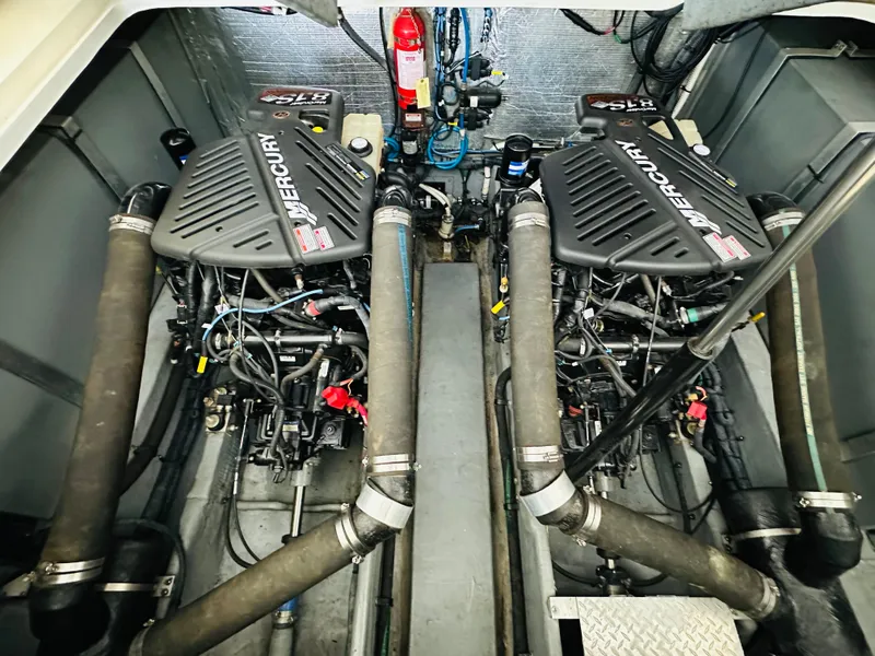 Slide: The Image of Engine room of 2002 Sea Ray 410 Express Cruiser with twin Mercury engines. - 42