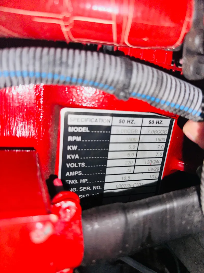 Slide: The Image of Close-up of engine specifications on a 2002 Sea Ray 410 Express Cruiser. - 47