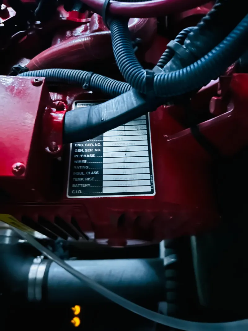 Slide: The Image of Close-up of a 2002 Sea Ray 410 Express Cruiser engine with visible serial number plate. - 48