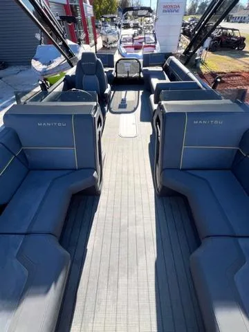 Slide: The Image of 2023 Manitou EXPLORE 22 pontoon boat with spacious seating and modern design. - 4
