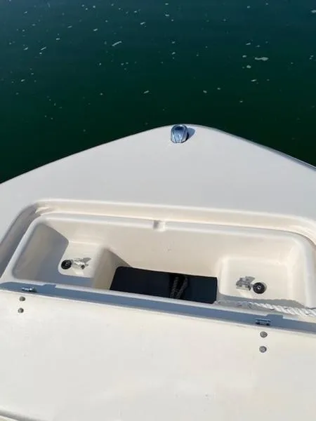 Slide: The Image of 2022 Grady-White Freedom 215 boat bow on calm water. - 12