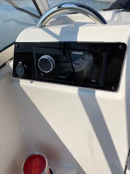 Slide: The Image of Grady-White Freedom 215 boat dashboard with Fusion stereo system, 2022 model. - 3