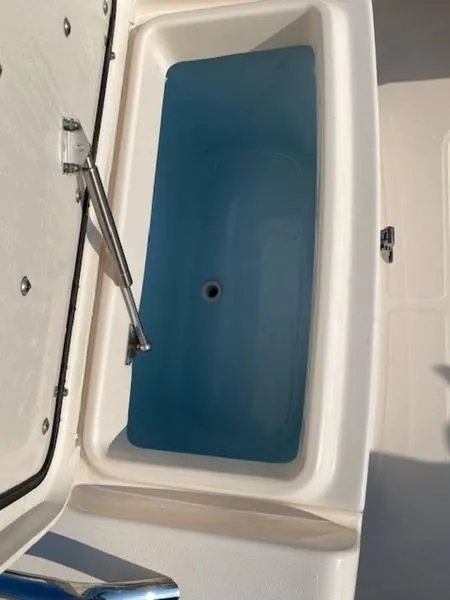 Slide: The Image of Open storage compartment on 2022 Grady-White Freedom 215 boat. - 4