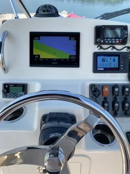 Slide: The Image of Dashboard of 2022 Grady-White Freedom 215 boat with navigation equipment. - 5