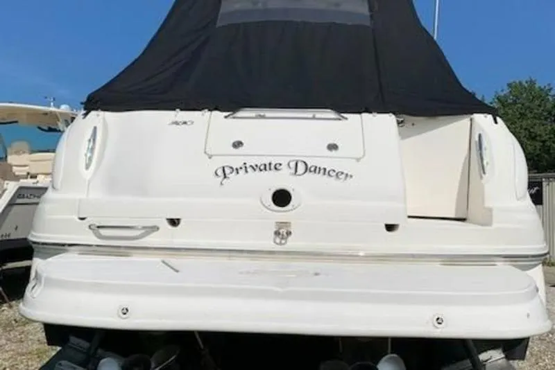 Slide: The Image of 2007 Sea Ray 280 Sundancer boat named "Private Dancer" with black cover. - 12