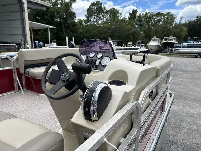Slide: The Image of 2021 Crestliner 180 Sprint Cruise boat interior with steering wheel and dashboard controls. - 12