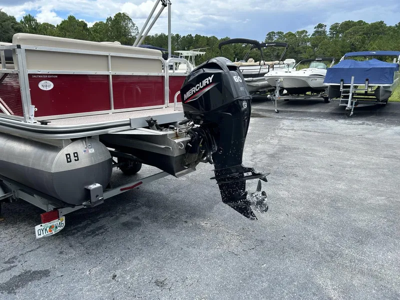 Slide: The Image of 2021 Crestliner 180 Sprint Cruise with Mercury outboard motor in a boatyard. - 7