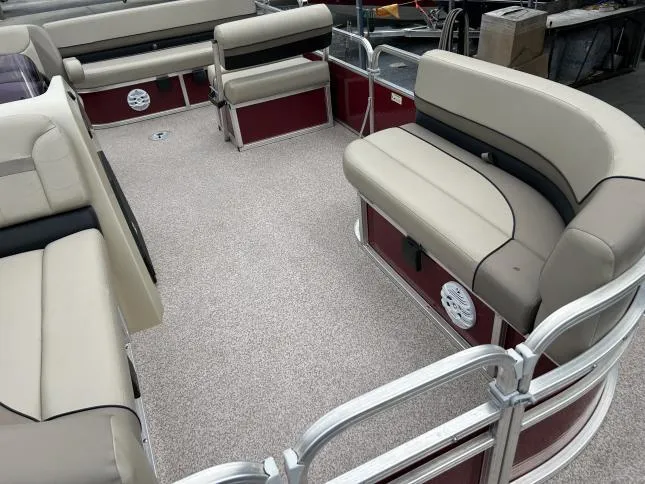 Slide: The Image of 2021 Crestliner 180 Sprint Cruise interior with beige seating and red accents. - 8