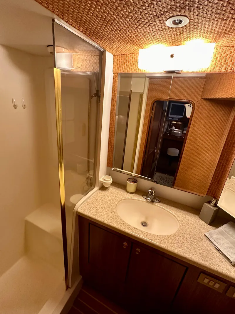 Slide: The Image of Bathroom interior of a 1997 Ocean Yachts 60 Super Sport with shower and vanity. - 17
